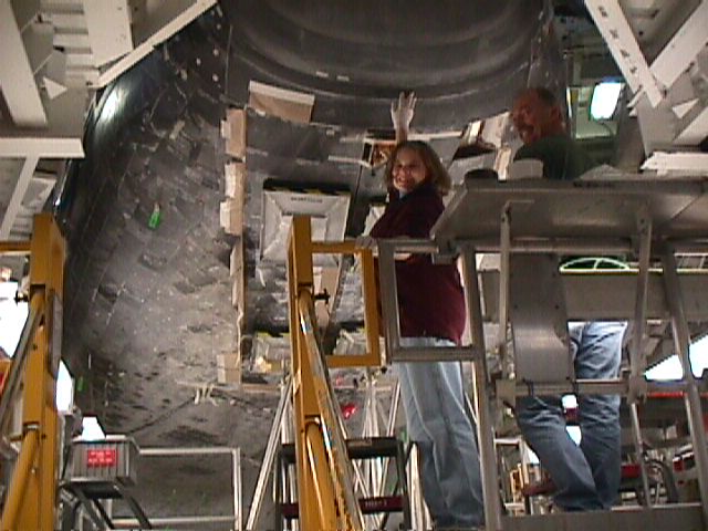 Katie Cauthen 'working' on Discovery's nose tiles :)
